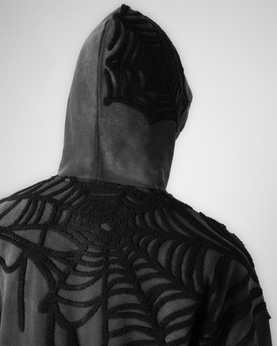 Spiderweb embroidery over the hood