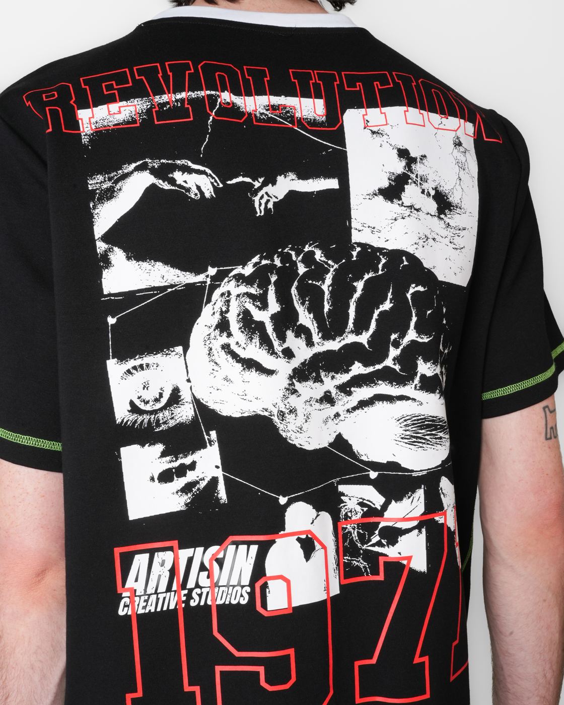 Collage print on the back of a black tee with 1971 and Creative Studios